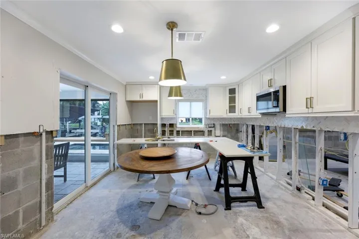 Access the lanai from the kitchen.