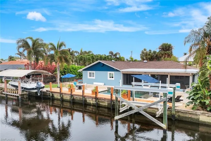 THIS is FLORIDA LIVING! HUGE dock with TWO boat lifts.