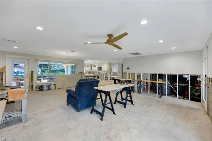 Home features an open concept with hurricane impact windows and doors.