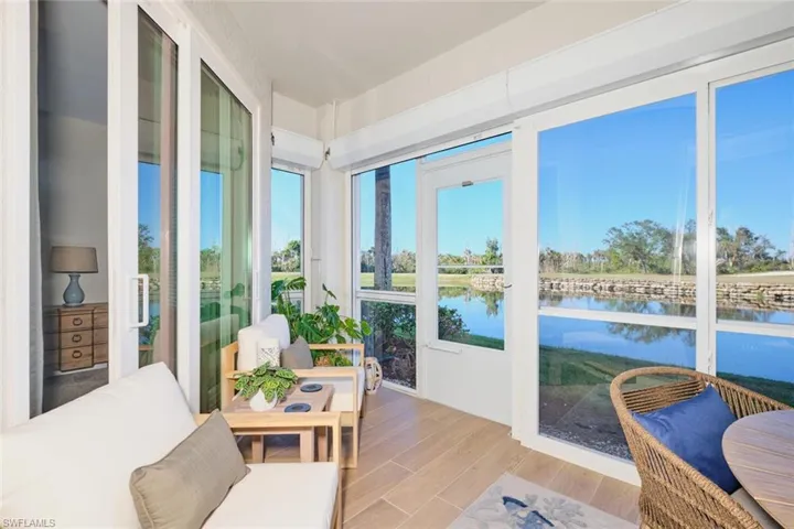 Sunroom / solarium with a water view