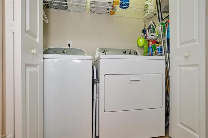 Laundry room with washing machine and clothes dryer