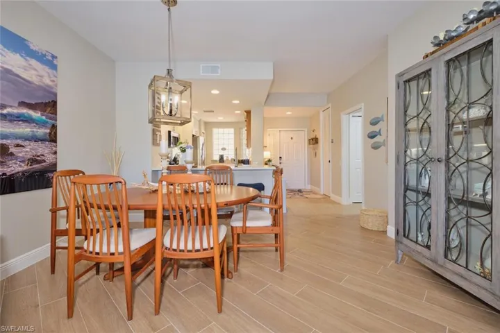Dining space with a chandelier and light wood-type flooring