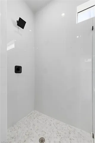 Full bathroom with a tile shower