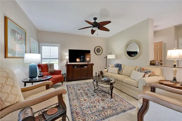 Living room featuring ceiling fan