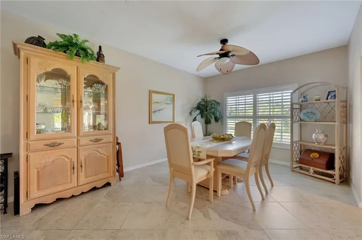 Dining room featuring ceiling fan and light tile floors