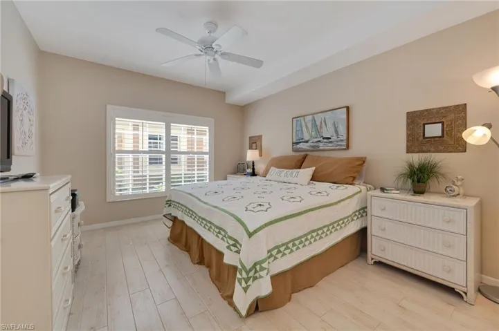 Bedroom featuring ceiling fan and light hardwood / wood-style flooring