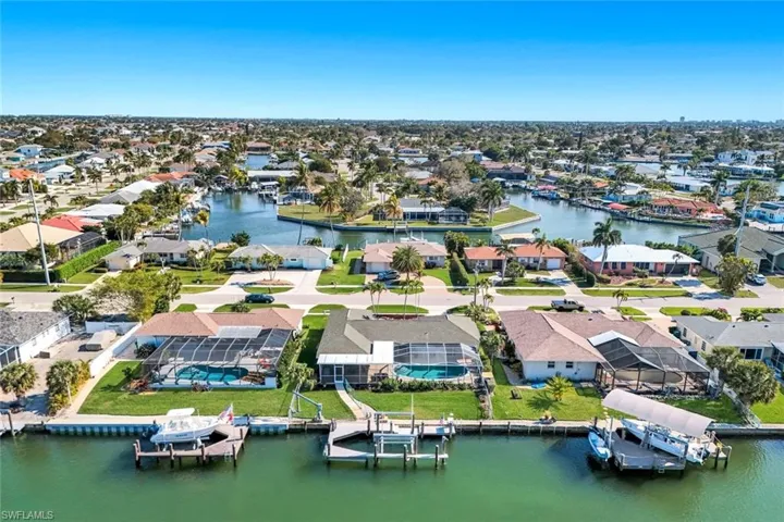 Aerial perspective of suburban area with a large body of water