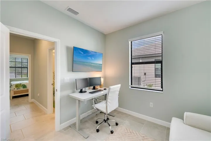 Office area with light tile patterned flooring
