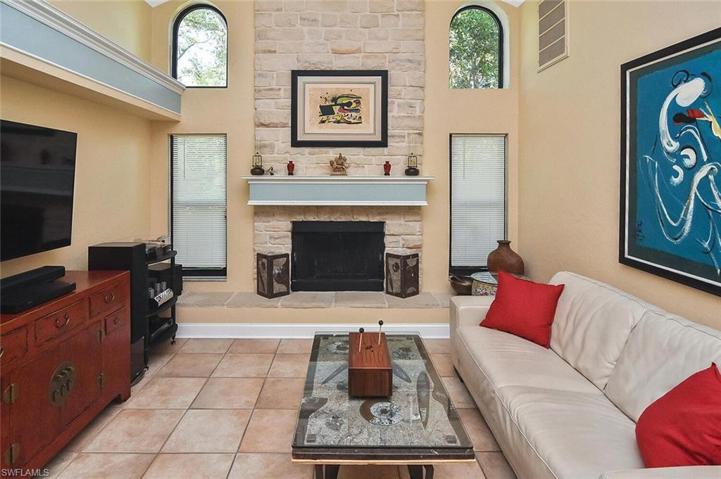 Beautiful stone wood burning fireplace in living room