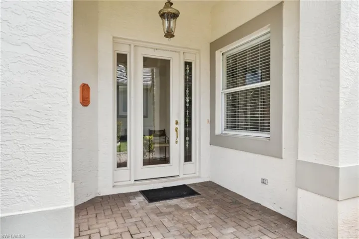 View of exterior entry featuring french doors