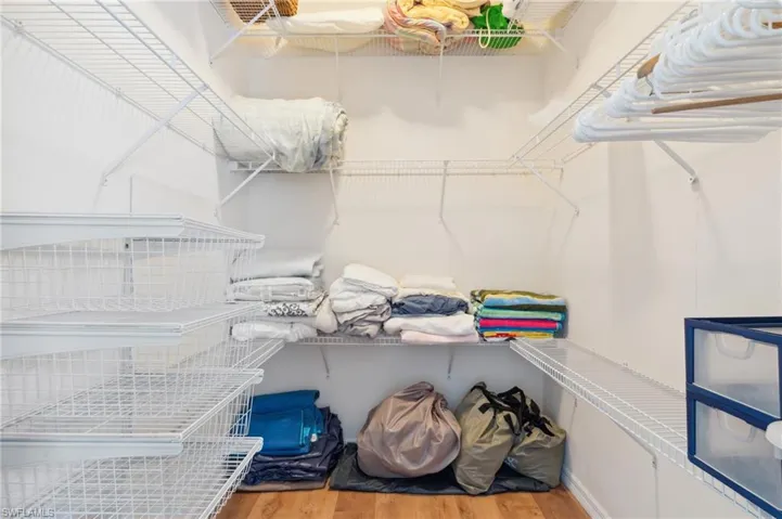 Walk in closet featuring light hardwood / wood-style flooring