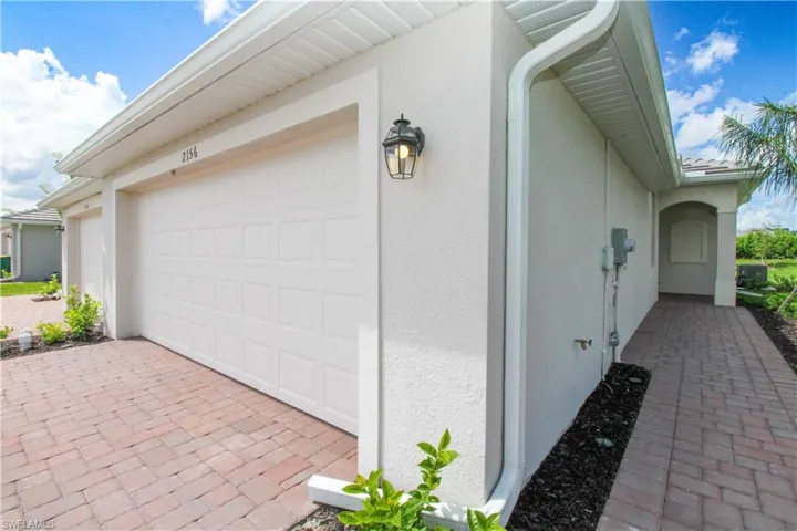 View of side of property featuring a garage