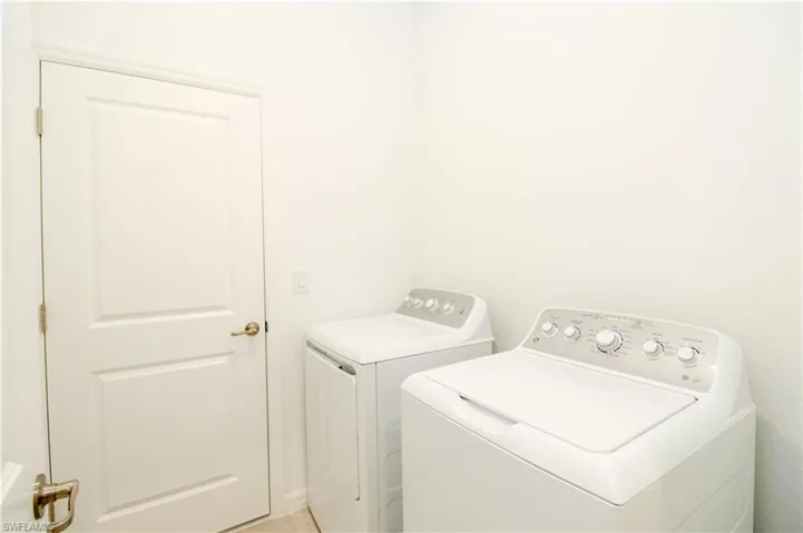 Washroom with washing machine and dryer