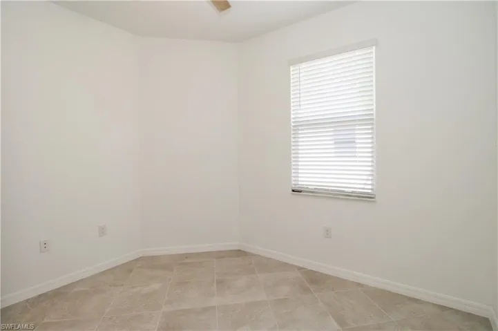 Spare room featuring light tile patterned floors