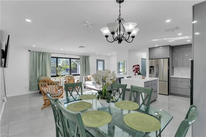 Dining space with recessed lighting, visible vents, and light tile patterned flooring