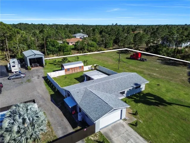 Drone / aerial view with a wooded view
