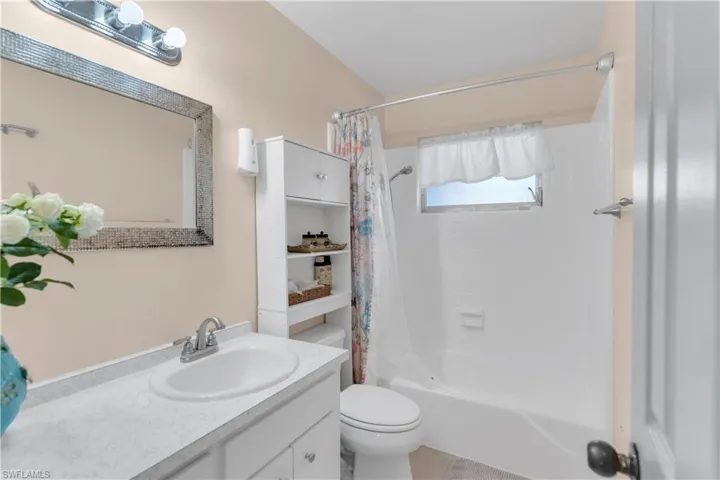 Full bath with toilet, shower / tub combo, and vanity