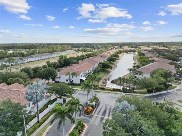 Aerial view with a water view and a residential view