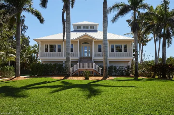 Main house with beautifully landscaped yard!