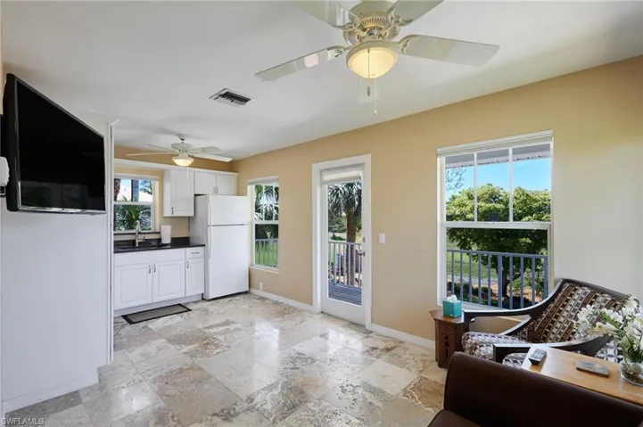 Living/kitchen area with door to the deck.