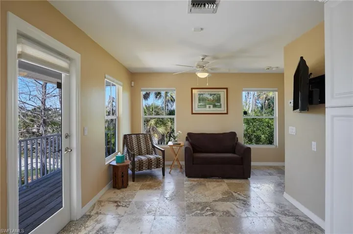 Living area showing all the sunlight through impact windows.