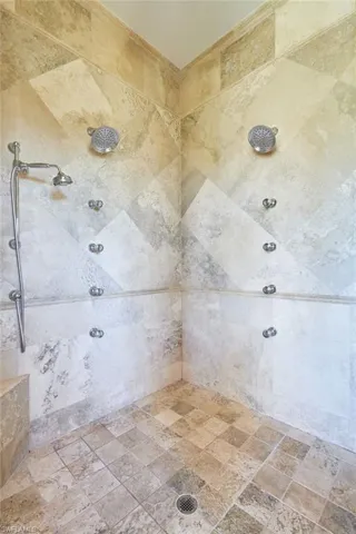 Beautiful tiled shower with custom jets and dual shower heads
