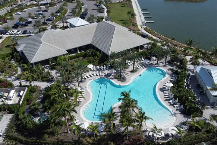 Birds eye view of property featuring a water view