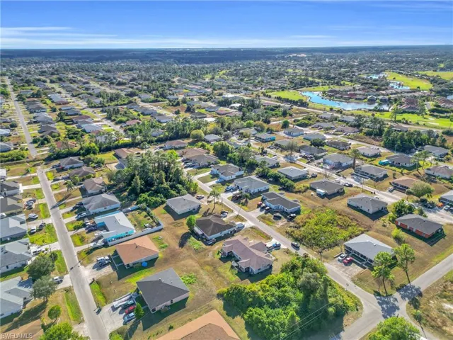 Aerial overview of property's location with nearby suburban area