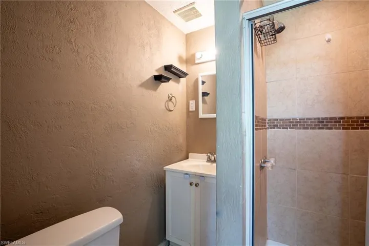 Bathroom featuring toilet and vanity