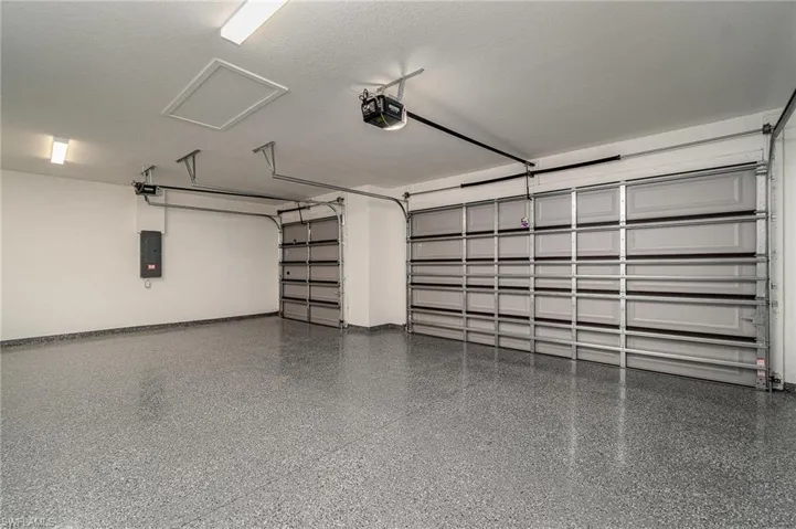 Nice 3 car garage with epoxy floors.