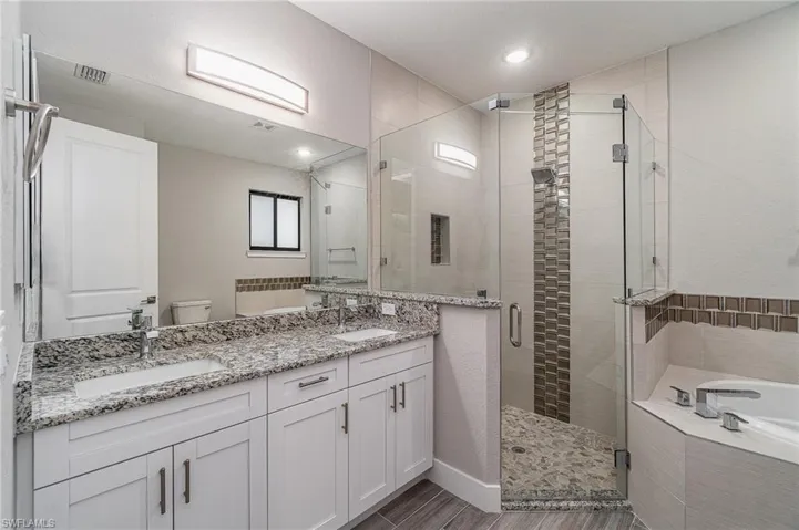 Primary bathroom with linen closet.