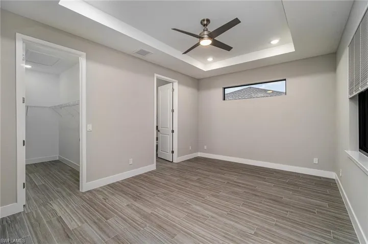 Primary bedroom with walk in closet.