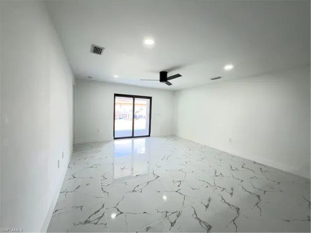 Spare room with light marble finish flooring, recessed lighting, and ceiling fan