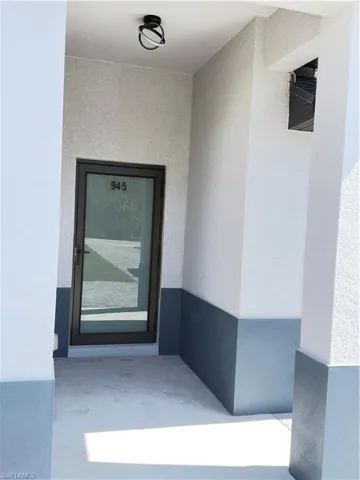 Property entrance with stucco siding