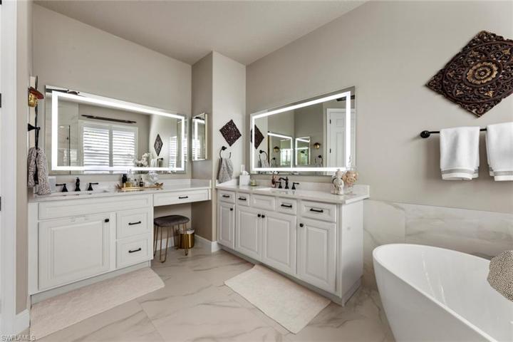 Master bath with custom lighted mirrors