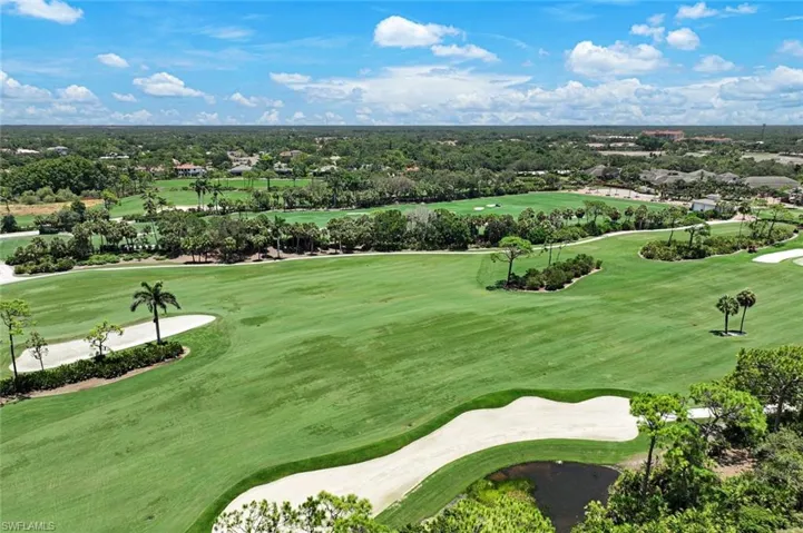 Expansive views of the Bonita Bay golf course and treetops beyond.