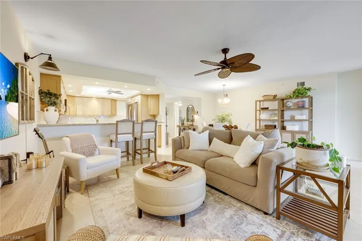 Comfortable and inviting living room with tropical views and seamless access to the lanai.