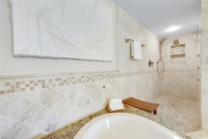 Spa-inspired bath with custom tile and a relaxing garden tub.