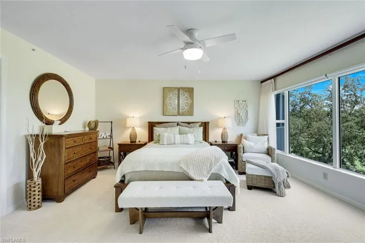 Wake up to a stunning view in this serene primary bedroom retreat.