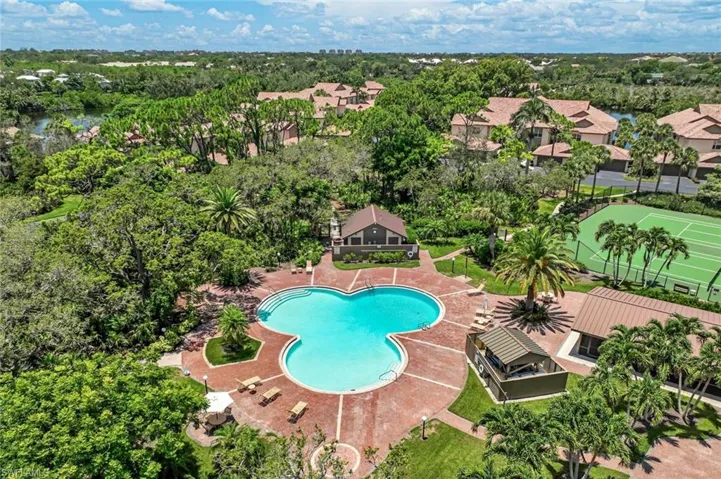One of Bonita Bay’s stunning private pools, tucked into lush landscaping.