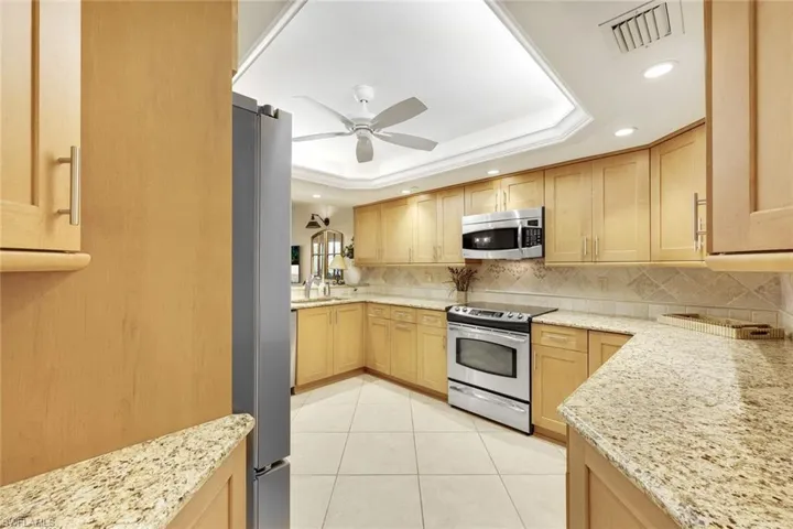 Kitchen offers generous prep space, updated appliances, and plenty of storage.