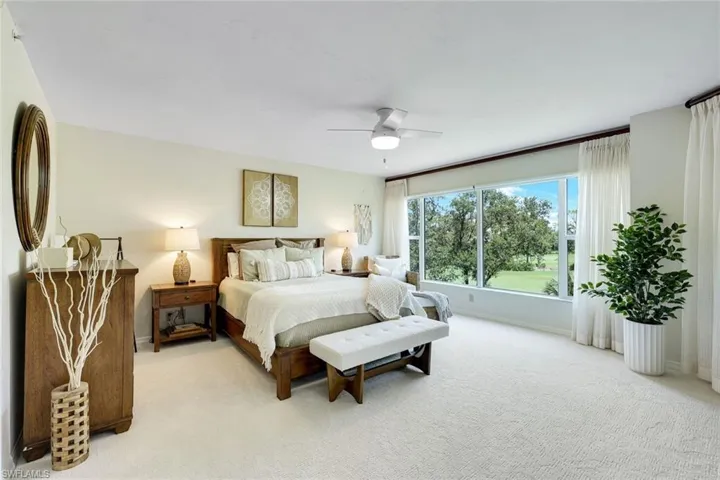 Large primary suite with peaceful views, natural light, and brand new plush carpeting.