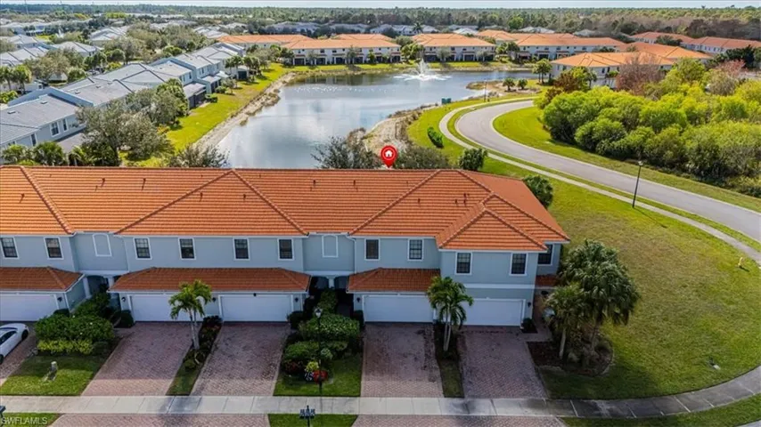 Aerial perspective of suburban area with a large body of water