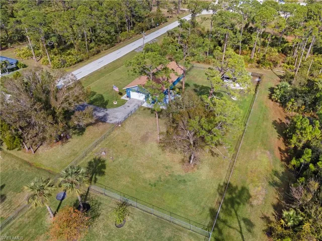 Birds eye view of property with a rural view