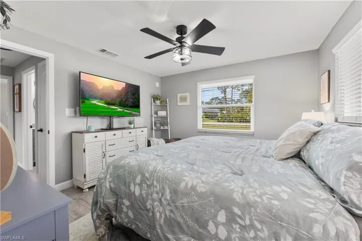 Bedroom featuring light wood-type flooring and ceiling fan
