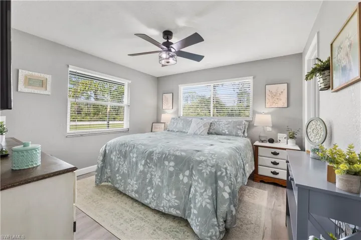 Bedroom with light wood-type flooring and ceiling fan