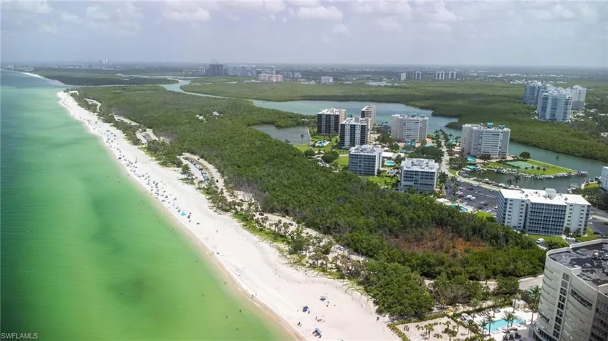 View of urban area with waterfront with a beach