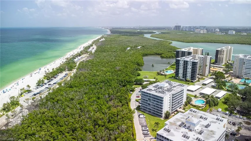 View of urban area featuring expansive beach