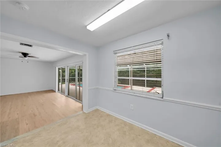 Spare room with a ceiling fan and baseboards