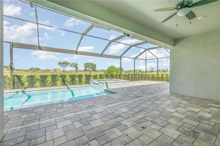 View of heated pool  and hot tub overlooking golf course, enjoy the serene quite evenings